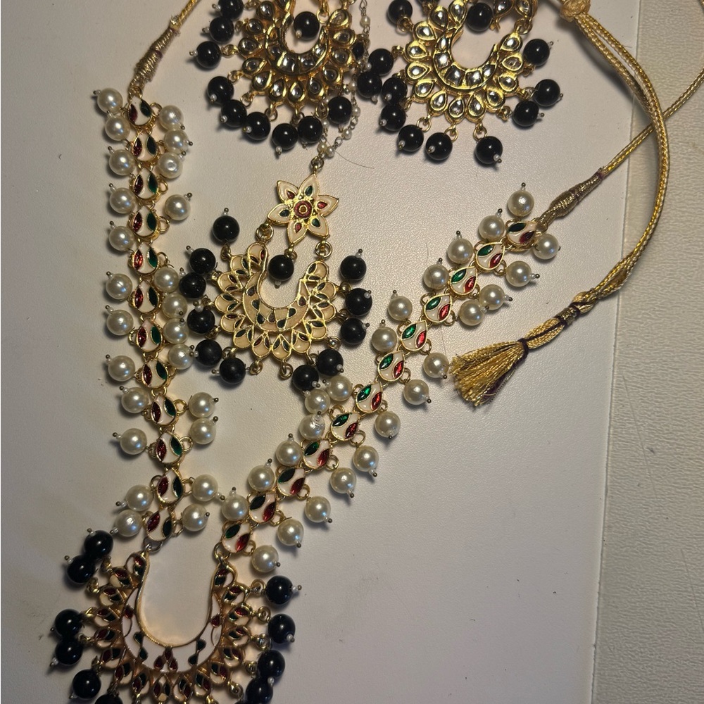 Ornate Gold and Black Necklace with Intricate Metalwork